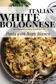 pasta with ragu bianco in a black bowl on a white tablecloth