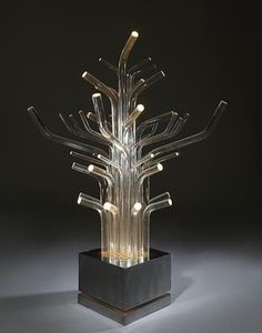 a glass sculpture with many lights on it