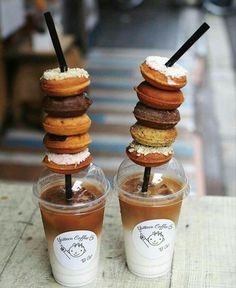 two cups filled with donuts on top of each other