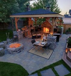 an outdoor patio with fire pit and seating area