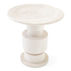 a white pedestal with two round bases on each side and one circular base on the other