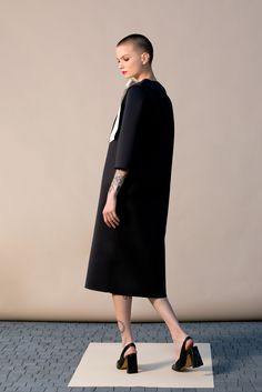 "With this beautiful Minimalist Dress we introduce our fashion for Spring 2019 ! This stylish black dress is cut in the the brand's most recognizable silhouette - the laid-back approach to elegance. The design has straight, elegant silhouette - it is our go-to for effortless, easy-to-wear pieces. Wear your occasion dress with sandals, high heels, ballerinas. ITEM DETAILS: - straight line - side pockets - shoulder bow decorations - custom orders: yes - color: black and creamy COMPOSITION AND CARE Black A-line Dress For Office Wear, Structured Knee-length Cocktail Dress, Elegant Structured Black Dress, Structured Black Mini Dress For Cocktail, Black Structured Mini Dress For Cocktail, Black Fitted Modern Midi Dress, Black Fitted Midi Dress Modern Style, Structured Midi Party Dress, Structured Knee-length Evening Midi Dress