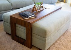 a coffee table sitting on top of a couch in a living room