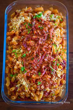 a glass dish filled with pasta and sauce