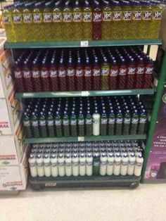 the shelves are full of sodas and other drinks for sale in a grocery store