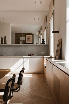 the kitchen is clean and ready to be used as a dining room or office area