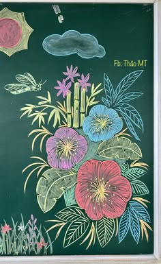 a chalkboard with flowers and plants painted on it's blackboard frame,