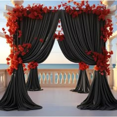 an open window with drapes and flowers on the curtains, overlooking the ocean in front of a balcony