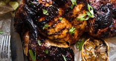 grilled chicken with lemons and parsley garnish