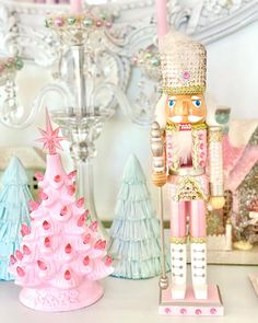 a nutcracker figurine stands next to a christmas tree and other decorations