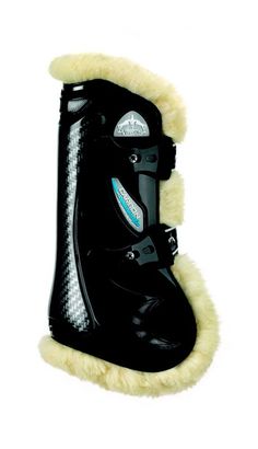 a pair of black snow boots with white fur lined around the soles and heel