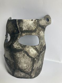 Embrace the anarchistic aesthetic with our hand-crafted, life-sized rust face mask recreation, this custom recreation was made with great care, making it an ideal addition to your cosplay costume or even just as an IRL token from the game. Designed with acute attention to detail, our real life recreation features a chrome finish, distressed metal textures and weathering effects, giving it the authentic appearance of an item crafted in the world of rust. Whether you're exploring monuments or atte Warrior Style Masks For Cosplay And Masquerade Events, Medieval Style Masks For Cosplay And Masquerade Events, Warrior Style Masquerade Mask For Halloween, Medieval Style Masks And Prosthetics For Masquerade Cosplay, Warrior Style Masks And Prosthetics For Larp And Halloween, Medieval Style Mask For Costume, Artistic Black Masks And Prosthetics For Cosplay, Medieval Masks For Fantasy Events, Medieval Mask For Cosplay