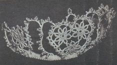 an old black and white photo of a lace doily on a piece of cloth