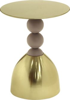 a gold table with three balls on top