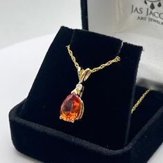 Beautiful Padparadscha and Diamond Pendant Necklace * 2.5ct Pear Cut Orange Padparadscha Sapphire measures 10x7mm * Brilliant Cut Diamond measures 2.2mm Round (G-H SI1) * 14k Yellow Gold * 16" or 18 inch Chain included - Select your Length Hallmarked & Gift Ready! This Sapphire is laboratory grown.  It is identical to the natural stone in every way including chemistry, composition & hardness.   TIMELESS, BEAUTIFUL & UNIQUE FINE ART JEWELRY Fine Jewelry Orange Necklaces For Anniversary, Orange Teardrop Jewelry For Formal Occasions, Gift Pear Necklace With Prong Setting, Gift Pear Shaped Necklace With Prong Setting, Pear-shaped Gemstones For Gifts In Fine Jewelry Style, Gift Pear-shaped Necklace With Prong Setting, Pear-shaped Necklace With Prong Setting For Gift, Orange Teardrop Anniversary Jewelry, Pear-shaped Fine Jewelry Gemstones For Gift