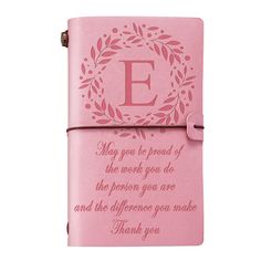 a pink leather journal with the letter e on it and an embellishment for someone's birthday