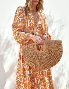 A must-have handbag for those sunny days and beyond. Crafted with natural raffia material, this curved handbag exudes a charming and stylish appeal that's sure to elevate your summer look. Chic and On-Trend: Our Half-Moon Straw Bag features a curved design that adds a touch of modernity and elegance to your outfit. Stay on-trend with this fashionable and eye-catching handbag that complements your style flawlessly. Eco-Friendly Raffia Material: Embrace the beauty of nature with this handbag, as i Chic Spring Beach Bag With Round Handle, Chic Summer Beach Bag With Round Handle, Trendy Summer Beach Bag With Round Handle, Chic Summer Shoulder Bag With Round Handle, Trendy Beach Bag With Round Handle For Summer, Trendy Straw Bag With Round Handle For Spring, Summer Crochet Shoulder Bag With Bamboo Handle, Summer Brown Beach Bag With Bamboo Handle, Summer Travel Crochet Bag With Round Handle