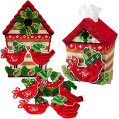 two small houses with red decorations on them