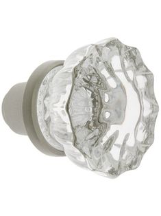 a glass door knob with an intricate design