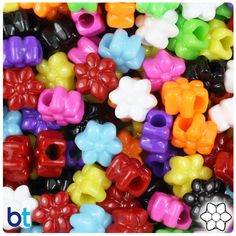 many different colored plastic bows on top of each other