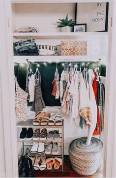 an open closet with shoes and other items