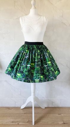 Circuti Board Skirt Gathered  full skirt made from a beautiful 100% cotton,  Circuit Board fabric. Each skirt is made by gathering the fabric onto  a 2 inch black elastic waistband. The length measures from the top of the waistband and comes in three lengths, 19", 22" or 25". Please choose length from the drop down menu. The waist measurement can be seen in the measurement guide below. Please choose waist size from the drop down menu. The skirt is pictured with a petticoat to show its potential Tiered Cotton Mini Skirt For Party, Party Cotton Tiered Mini Skirt, Green Cotton Midi Skirt, Trendy Long Green Skirt, Trendy Green Long Skirt, Green Stretch Mini Skirt With Lined Skirt, Green Stretch Midi Skirt, Trendy Green Lined Skirt, Trendy Green Cotton Skirt