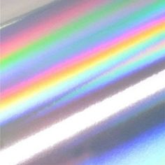 an image of a rainbow colored metallic sheeting material that looks like it has been painted