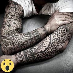 a man with tattoos on his arm and arms