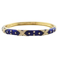 Hidalgo 18K Yellow Gold Blue Enamel Diamond X Hinged Bangle Bracelet Hinged bangle bracelet in 18 karat yellow gold with diamond "X" detailing and blue enamel. Hallmark: HIDALGO 750 Weight: 23.64 g/ 15.2 dwt. Measurements: 6.5 in. 5.4 mm thick. # of Diamonds: 27 Cut/Shape: Round Brilliant Carat Weight: .60 cts Color/Clarity: VS1, G Very good condition, professionally polished. Will come packaged in a gift box or pouch (when possible) and will be shipped U.S. Priority Mail Insured. AD121323/17KC2 Modern Bangle, 18k Gold Bangle, Contemporary Bracelets, Red Bangles, White Gold Bangle, Resin Bangles, Yellow Gold Bangle, Enamel Bangle, Crystal Bangle