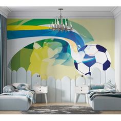 a bedroom with a soccer theme painted on the wall and a chandelier hanging from the ceiling