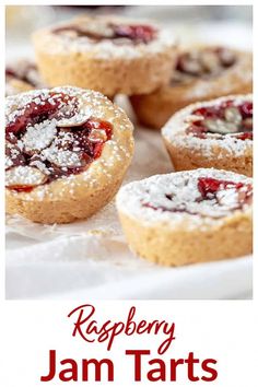 raspberry jam tarts on a white plate with the words raspberry jam tarts