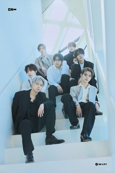 group of young men sitting down on stairs