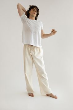 A cozy cotton drawstring pant that can be dressed up or down for every day of the week. Much like your boyfriend's pants, this style is intended to fit oversized. We recommend sizing down for a less oversized look. Inspired by vintage men's workwear, this durable fabric is speckled, and features tonal embroidery, and a hidden pocket on the inside. Orseund Iris offers a 7-day exchange & return policy for all items except for final sale pieces. Relaxed Fit Drawstring Bottoms For Loungewear, Everyday Relaxed Fit Drawstring Pants, Fall Wide Leg Pants With Drawstring And Relaxed Fit, Cotton Bottoms For Lounging With Relaxed Fit, Comfortable Cotton Sweatpants For Daywear, Relaxed Cotton Pants With Elastic Waistband, Comfy Cotton Wide Leg Bottoms, Comfy Wide Leg Cotton Bottoms, Everyday Wide Leg Drawstring Pants