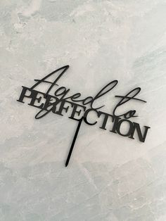 a metal sign that says affection and perfection on it