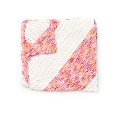 an orange and pink blanket on a white background