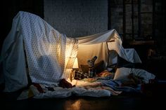 a bed with a white sheet on top of it