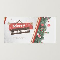 a merry christmas banner hanging from the side of a wall with candy canes on it