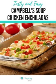 a casserole dish filled with chicken enchiladas and topped with tomatoes