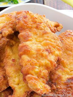 some fried food in a white bowl on a table