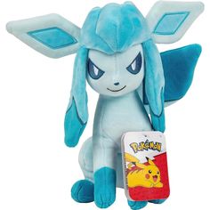 a blue stuffed animal with big ears holding a pokemon book in it's hand