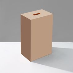 a brown box sitting on top of a white table