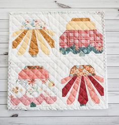 a quilted placemat with different designs on it