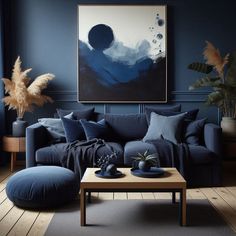 a living room with blue walls and furniture in the corner, including a large painting on the wall