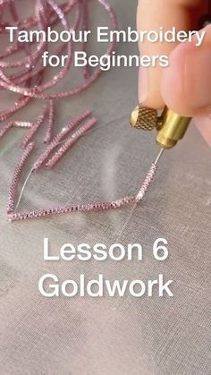 a person is working with some thread on a piece of fabric and the text reads, tambour embroidery for beginners lesson 6 goldwork