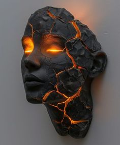 a woman's head with glowing eyes is shown in the shape of a rock