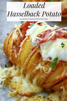 loaded hasselback potato with cheese and tomato sauce on top, topped with parmesan