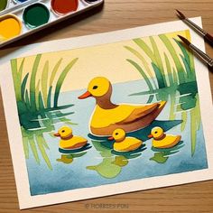 a watercolor painting of ducks and their babies in a pond with paintbrushes next to it