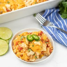 a white bowl filled with mexican rice and green peppers