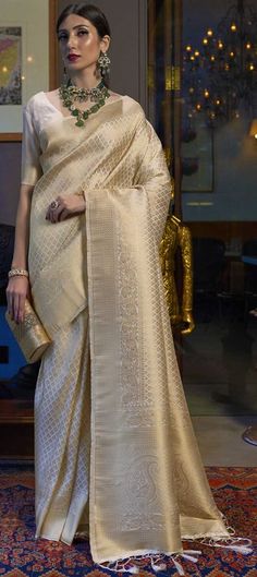 Cost Includes Saree,Unstitched BlouseFall & Edging Work Description: White and Off White color Saree in Art Silk, Silk fabric with Weaving work Fabric: Art Silk, Silk Work: Weaving Color Family: White and Off White Style: South Occasion: Traditional Saree Dimension: 530 Cm x 110 Cm ( L x W) Blouse Length: 80 Cm Approx Washing Instruction: Dry Wash Off White Banarasi Saree, White Banarasi Saree, White Silk Saree, Sarees Ideas, Mummy Papa, Off White Saree, Reception Saree, Sari Design, Awards Night