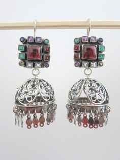 Design code: PBJ-03-S Handcrafted in sterling silver and set with assorted genuine semi-precious stones. These stunning jhumkas (chandelier earrings) are modular/detachable. They have a unique mechanism at the back that allows you to separate the top and bottom parts. You could therefore take off the bottom part and wear only the top part for a lighter look. You could also wear just the bottom of the Jhumka on hoops (as shown in image 3). You can also buy only the top part/earrings of these jhum Jhumka Collection, Unique Silver Jewelry, Jewelry And Accessories, Contemporary Jewelry, Modern Aesthetic, Sterling Silver Studs, Chandelier Earrings, Semiprecious Stones, Precious Stones